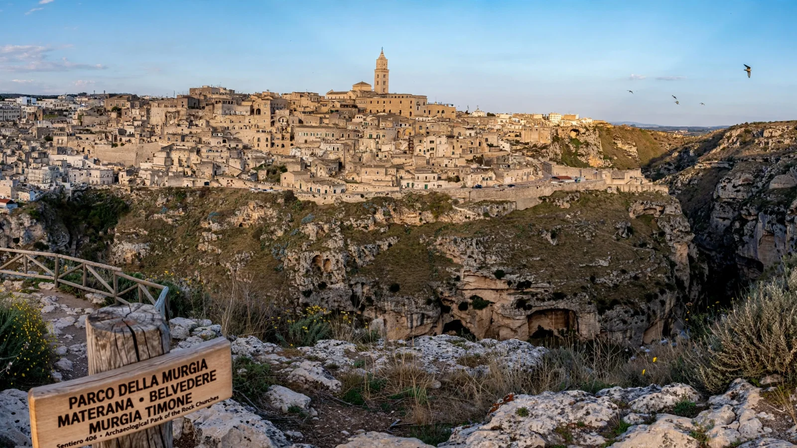 Panoramic view of the Sassi of Matera from the Belvedere di Murgia Timone plateau across the Gravina ravine